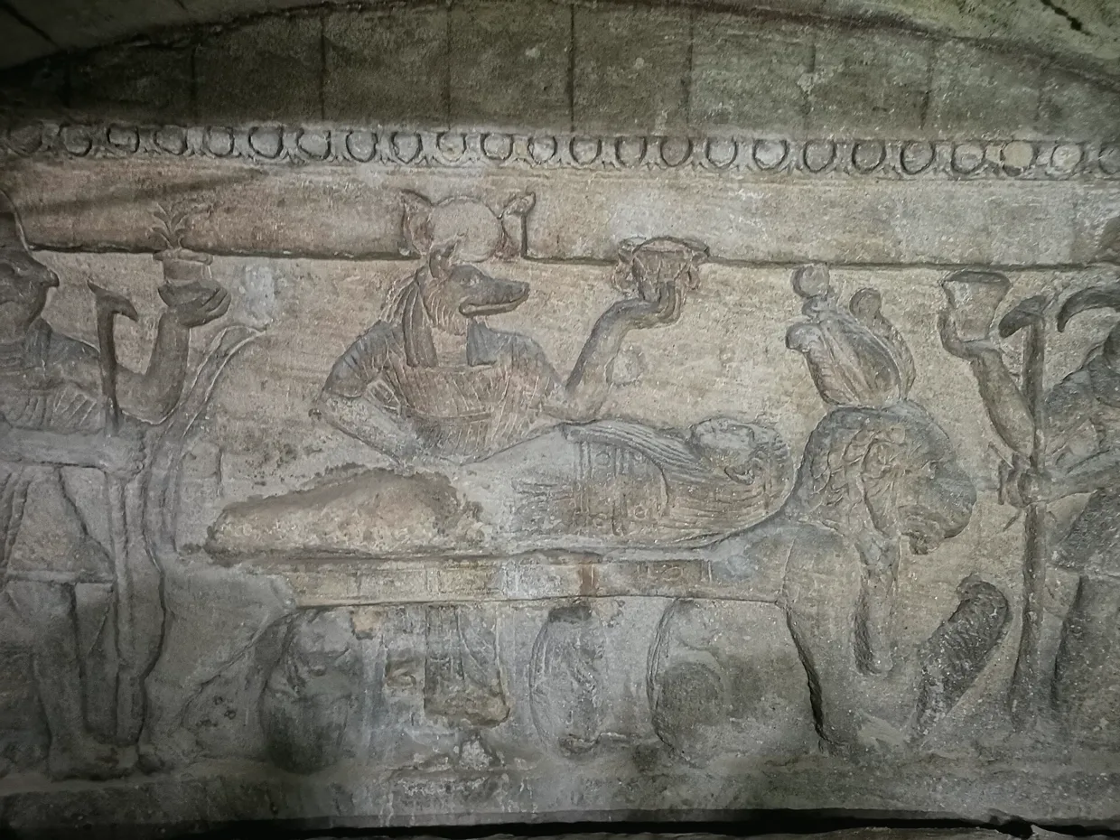 A relief carved into the rock at Kom El Shoqafa.