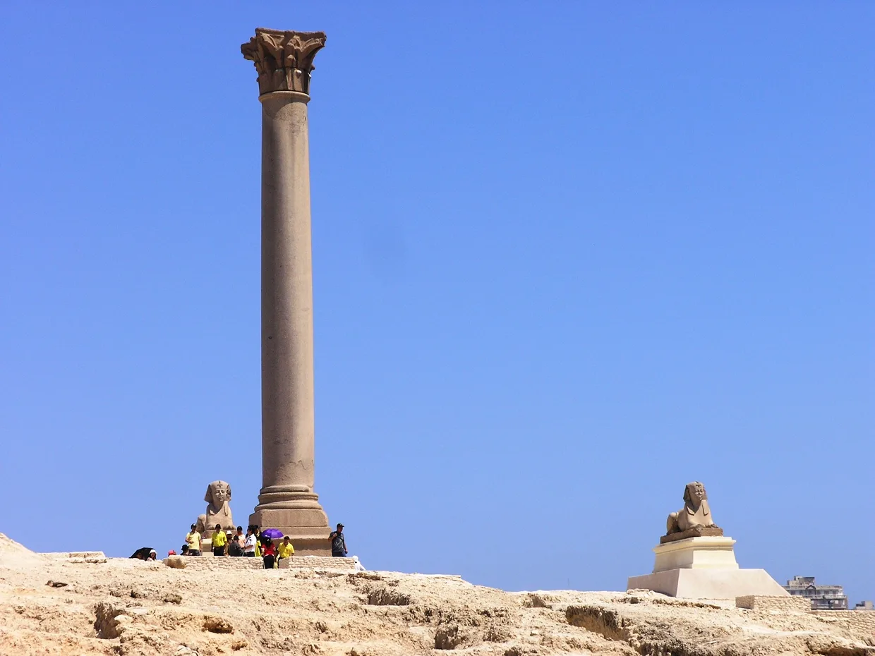 Pompey&rsquo;s Pillar, a tall polished granite column with a sphinx at its base.