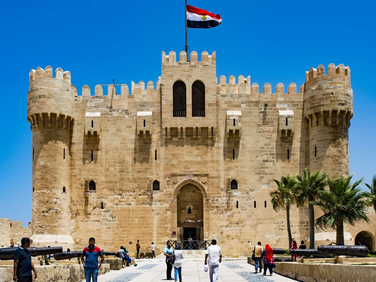 The Citadel of Qaitbay, a pale limestone fort with round corner towers.